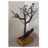 LL  - Metal Sculpture of Child on Swing Under Tree
