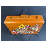 Vintage Samsonite Suitcase with Travel Stickers and Assorted Clothing
