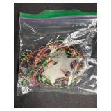 Collection of Handmade Felt and Beaded Christmas Ornaments in Snowman Suitcase