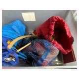 Collection of Tote Bags and Mesh Caps in Storage Bin