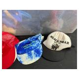 Collection of Tote Bags and Mesh Caps in Storage Bin