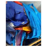 Collection of Tote Bags and Mesh Caps in Storage Bin