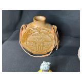 Collection of Vintage Curiosities Including Pottery Canteen, Figurines, Coasters, and Decorative Items