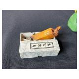 Collection of Vintage Curiosities Including Pottery Canteen, Figurines, Coasters, and Decorative Items