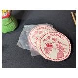 Collection of Vintage Curiosities Including Pottery Canteen, Figurines, Coasters, and Decorative Items