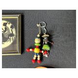 Collection of Vintage Curiosities Including Pottery Canteen, Figurines, Coasters, and Decorative Items