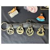 Collection of Vintage Curiosities Including Pottery Canteen, Figurines, Coasters, and Decorative Items