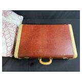 Vintage Brown Suitcase with Red and White Handmade Quilt