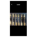 Siam 24-Piece Black and Brass Flatware Set with Embossed Handles