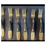 Siam 24-Piece Black and Brass Flatware Set with Embossed Handles