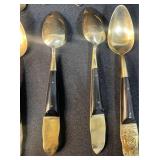 Siam 24-Piece Black and Brass Flatware Set with Embossed Handles