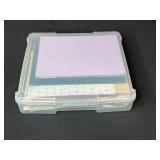 Assorted Scrapbook Paper Collection in Plastic Storage Case