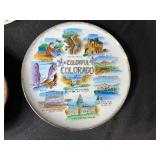 Eclectic Decorative Collection with Blue Glass Bottles, Plates, Wood Dish, and Longaberger Basket