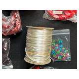 Collection of Jewelry Making Supplies with Cords, Beads, Clasps, and Findings