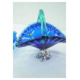 Vintage White Crystal Made in Italy Blue Glass basket with silver-toned pedestal; Vintage Fenton Colonial Blue Hobnail Glass Six-Candle Holder Pedestal Bowl