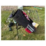 Golf Clubs in A Golf Bag, Ice Bucket, Etc.