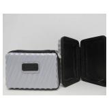 Pair of Small Hard Plastic TUMI Travel Cases
