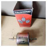 Various Automotive Parts including NAPA Brakes, Power Torque Transmission Filter Kit, and MicroGard Fuel Filters - See Pics