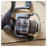 Assorted Fishing Equipment including Silstar Vertex Reel, Ice Fishing Rods, Rattle Reel, and Wire Fish Basket