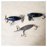 Vintage fishing lures with treble hooks including Jitterbug