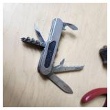 Fishing Tackle and Tools Including Pliers, Multi-tool, and Sinkers