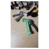 Assorted Garden Hose Connectors, Nozzles, and Accessories