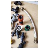 Assorted Garden Hose Connectors, Nozzles, and Accessories
