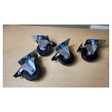 Heavy-duty swivel casters with brakes set, including mounting plates and locking mechanisms