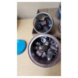 Assorted metal fittings and connectors in various containers