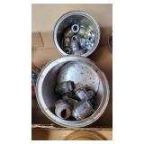 Assorted metal fittings and connectors in various containers