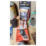 Assorted Automotive Parts Lot including Dorman Sending Unit Retainers, Autolite Spark Plugs, and Anti-Theft Door Lock Knobs