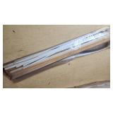 Assorted Construction and Plumbing Supplies including Squeegee, Fuel Tank Strap, Heating Tape, and Insulation Rolls