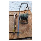 Hose reel and garden tools including hose reel, soil augers