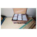 Leather Case with Cassette Tapes (Kenny Rogers, MC Hammer, Footlose) and Yardsticks