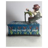 This classic piece is a must-have for collectors of mechanical banks and unique Americana decor! Featuring a charming fisherman theme, this cast iron bank offers both visual appeal and interactive fun