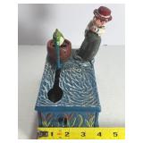 This classic piece is a must-have for collectors of mechanical banks and unique Americana decor! Featuring a charming fisherman theme, this cast iron bank offers both visual appeal and interactive fun