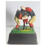 VINTAGE "CALAMITY" CAST IRON MECHANICAL COIN BANK - FOOTBALL/RUGBY THEME