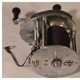 LL-FR - Pair of Fishing Reels Including Johnson Spincast and Conventional Reel