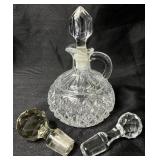 Large Collection of Glass Cruets and Decanters with Stoppers