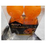 6 Pickle Balls and 4 Visors...