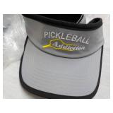 6 Pickle Balls and 4 Visors...