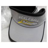 6 Pickle Balls and 4 Visors...