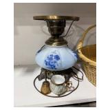 Vintage Blue Floral Lamp, Basket, Books, Candle, and Figurines Assortment