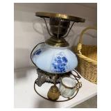 Vintage Blue Floral Lamp, Basket, Books, Candle, and Figurines Assortment