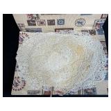 Collection of Vintage Lace Doilies in Patterned Fabric Sleeve