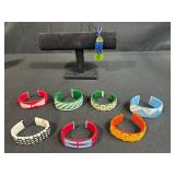 Collection of Woven Plastic Cuff Bracelets and 1 Beaded Bracelet