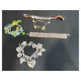 Collection of Bracelets Including Silver Tone Charm, Gold Tone Pearl Charm, Beaded, and Braided Styles