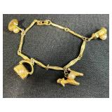 Collection of Bracelets Including Silver Tone Charm, Gold Tone Pearl Charm, Beaded, and Braided Styles