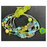 Collection of Bracelets Including Silver Tone Charm, Gold Tone Pearl Charm, Beaded, and Braided Styles