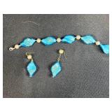 Assorted Costume Jewelry Lot: Bracelets, Earrings, and Charm Bracelet